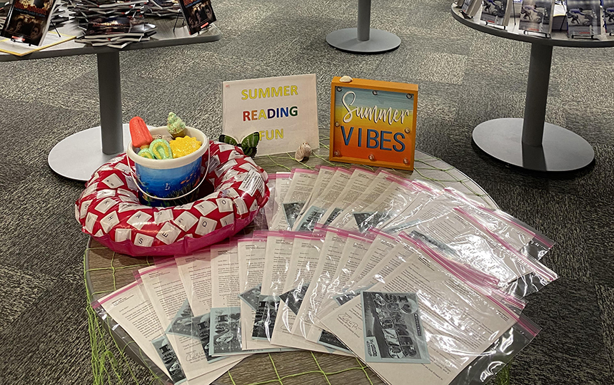 table decorated with signs, materials to encourage reading