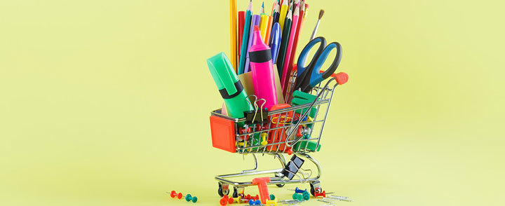 shopping cart filled with school supplies