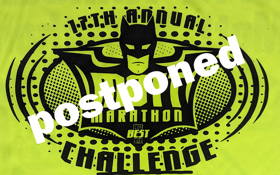 Text postponed over marathon batman logo.