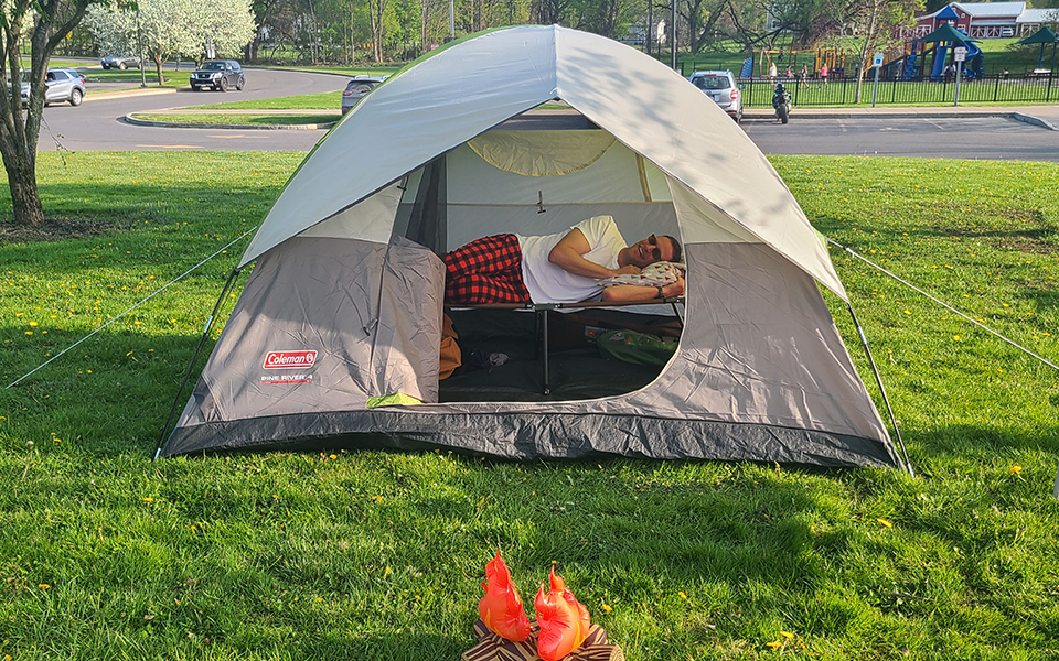 Tent, outdoors, man lying down inside
