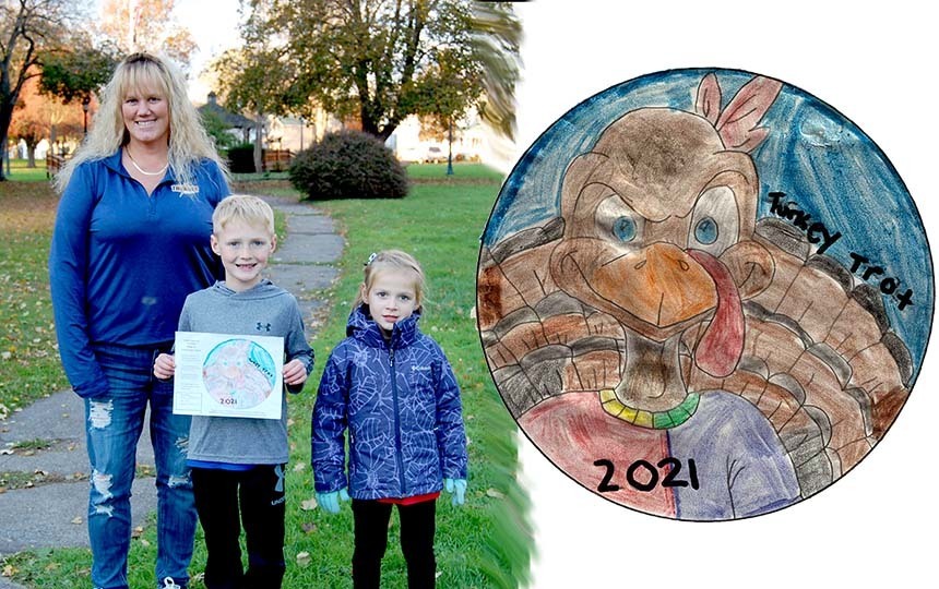 Adult, 2 children outdoors, student's artwork