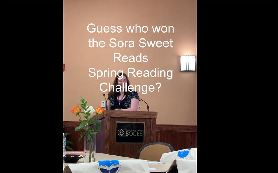 woman at podium, dining room, text: Guess who won the Sora Sweet Reads Spring Reading Challenge?